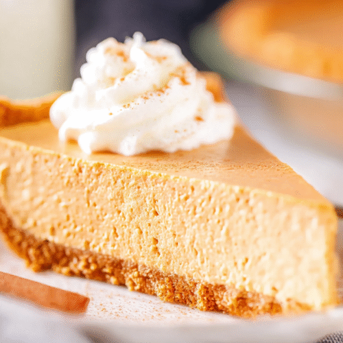 No Bake Pumpkin Pie with whipped cream and pumpkin spice garnish