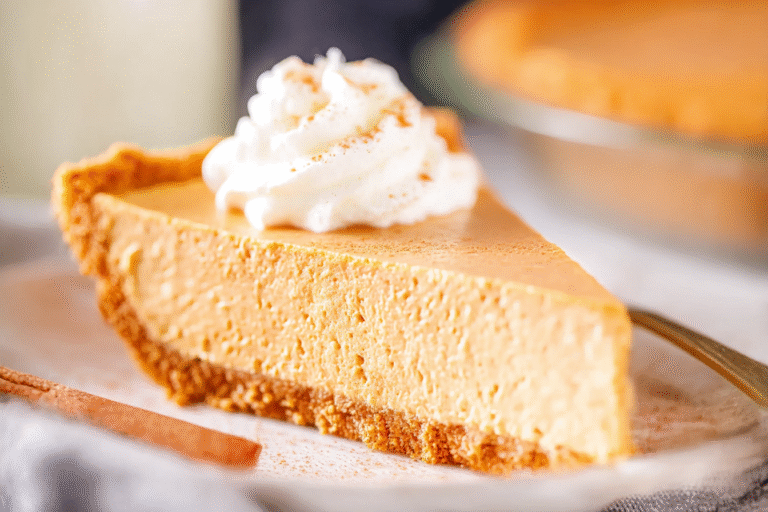 No Bake Pumpkin Pie with whipped cream and pumpkin spice garnish